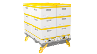 A picture of a 4 Beehive Pallet kit with the yellow powder coated legs engaged. The beehives are three stories high, and all feature yellow metal top covers.