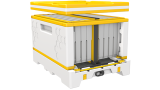 A picture of the HiveIQ nucleus system, featuring the 4 frame nuc divider board and entrance reducer.